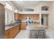 Charming kitchen with stainless steel appliances, a center island, and bright recessed lighting throughout at 10652 W Coronado Rd, Avondale, AZ 85392
