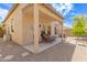Cozy covered patio with stylish seating, ideal for outdoor relaxation and entertaining at 10652 W Coronado Rd, Avondale, AZ 85392