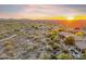 Expansive aerial view of the neighborhood with mountain views, mature landscaping, and swimming pool, offering a sense of community at 10811 E Acoma Dr, Scottsdale, AZ 85255