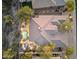 Breathtaking aerial view of a private estate with a sparkling pool, lush landscaping, and outdoor entertaining areas at 10811 E Acoma Dr, Scottsdale, AZ 85255