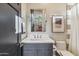 Chic bathroom with modern vanity, stylish mirror, and a walk-in shower at 10811 E Acoma Dr, Scottsdale, AZ 85255