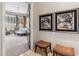 Spacious bedroom entrance featuring unique wall art, and tile flooring at 10811 E Acoma Dr, Scottsdale, AZ 85255