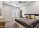 Relaxing bedroom with neutral tones, plantation shutters, and a comfortable bed at 10811 E Acoma Dr, Scottsdale, AZ 85255