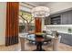 Comfortable dining area with backyard views and built-in desk at 10811 E Acoma Dr, Scottsdale, AZ 85255