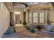 Stunning front entrance with mature cacti and desert landscaping at 10811 E Acoma Dr, Scottsdale, AZ 85255
