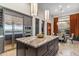 Spacious kitchen island with marble countertop and stainless steel appliances at 10811 E Acoma Dr, Scottsdale, AZ 85255
