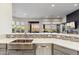 Open kitchen layout with island and view of backyard seating at 10811 E Acoma Dr, Scottsdale, AZ 85255