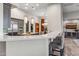 Kitchen island open to dining area with barstool seating at 10811 E Acoma Dr, Scottsdale, AZ 85255
