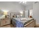 Well-lit bedroom with neutral tones, decorative pillows, and a quaint wooden bed frame at 1120 N Val Vista Dr # 10, Gilbert, AZ 85234
