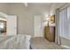 Bedroom featuring neutral walls, carpeted floors, and a wood dresser at 1120 N Val Vista Dr # 10, Gilbert, AZ 85234