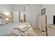 Bright bedroom showcasing neutral walls, a tray with a book, and white-washed furniture at 1120 N Val Vista Dr # 10, Gilbert, AZ 85234