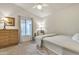 Comfortable bedroom with a single bed, carpeted floors, and dresser at 1120 N Val Vista Dr # 10, Gilbert, AZ 85234