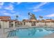 Inviting community pool surrounded by lounge chairs, perfect for relaxing and enjoying the outdoors at 1120 N Val Vista Dr # 10, Gilbert, AZ 85234