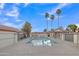 Inviting community pool surrounded by palm trees, perfect for relaxing and enjoying the outdoors at 1120 N Val Vista Dr # 10, Gilbert, AZ 85234