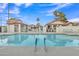 Inviting community pool surrounded by palm trees, perfect for relaxing and enjoying the outdoors at 1120 N Val Vista Dr # 10, Gilbert, AZ 85234