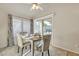 Cozy dining area with a sliding glass door and stylish furniture at 1120 N Val Vista Dr # 10, Gilbert, AZ 85234