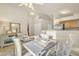 Dining room with set table, view to kitchen, ceiling fan, and modern decor at 1120 N Val Vista Dr # 10, Gilbert, AZ 85234