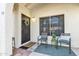 Inviting front entrance with a decorative wreath and seating area at 1120 N Val Vista Dr # 10, Gilbert, AZ 85234