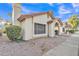 Side view of a single-story home with low-maintenance landscaping and a tile roof at 1120 N Val Vista Dr # 10, Gilbert, AZ 85234