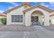 Attractive home exterior with well-maintained desert landscaping and a covered entryway at 1120 N Val Vista Dr # 10, Gilbert, AZ 85234