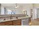 Kitchen area featuring stainless steel sink and appliances with bright natural light at 1120 N Val Vista Dr # 10, Gilbert, AZ 85234