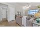 Open living room showcasing a sofa, decor, and a view of other rooms at 1120 N Val Vista Dr # 10, Gilbert, AZ 85234