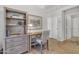 Office with desk and bookshelves and easy access to the rest of the home at 1120 N Val Vista Dr # 10, Gilbert, AZ 85234