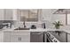 Modern kitchen with stainless steel appliances, sleek countertops, and ample storage at 113 S Ocean Dr, Gilbert, AZ 85233