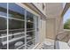 Charming balcony with comfortable seating, a small table, and a stylish striped rug for outdoor enjoyment at 11333 N 92Nd St # 2049, Scottsdale, AZ 85260
