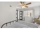 Bright bedroom with modern decor, including a large window, ceiling fan and en-suite bathroom at 11333 N 92Nd St # 2049, Scottsdale, AZ 85260