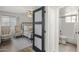 Comfortable bedroom featuring an ensuite bathroom and large window for plenty of natural light at 11333 N 92Nd St # 2049, Scottsdale, AZ 85260