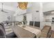 Open dining room with modern chandelier and views of living room at 11333 N 92Nd St # 2049, Scottsdale, AZ 85260