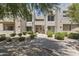 Well-maintained condo complex featuring tidy landscaping and convenient access to upper units via stairs at 11333 N 92Nd St # 2049, Scottsdale, AZ 85260