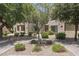 Attractive condo building with neat landscaping, mature trees, and well-maintained pathways at 11333 N 92Nd St # 2049, Scottsdale, AZ 85260