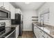 Updated kitchen featuring granite countertops, stainless steel appliances, and wood floors at 11333 N 92Nd St # 2049, Scottsdale, AZ 85260