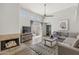 Bright living room features a fireplace, high ceilings, and a balcony with sliding glass doors at 11333 N 92Nd St # 2049, Scottsdale, AZ 85260
