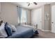 Cozy bedroom with a wrought iron bed frame, neutral walls, and bright natural light at 11466 N 162Nd Ln, Surprise, AZ 85379