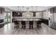 Well-equipped kitchen featuring stainless appliances, granite counters, kitchen island, and sliding glass doors to pool at 11466 N 162Nd Ln, Surprise, AZ 85379