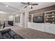 Spacious living room featuring built in shelving and decorative wood accent wall at 11466 N 162Nd Ln, Surprise, AZ 85379