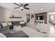 Comfortable living room with plush seating, a wood accent wall, and stylish decor at 11466 N 162Nd Ln, Surprise, AZ 85379