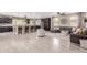 Open floor plan featuring a modern kitchen that transitions into a cozy living area with neutral décor at 11466 N 162Nd Ln, Surprise, AZ 85379