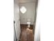 Bright bathroom featuring wood-look floors, decorative window, and white fixtures at 12245 N 21St Ave # 1, Phoenix, AZ 85029