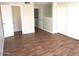 Spacious bedroom with wood-look floors and ample closet space, offering comfort and functionality at 12245 N 21St Ave # 1, Phoenix, AZ 85029