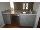 Kitchen featuring stainless steel appliances, granite countertop, modern sink, and gray cabinets at 12245 N 21St Ave # 1, Phoenix, AZ 85029