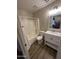 Clean bathroom featuring a shower-tub combo and a sleek vanity at 12422 N 121St Dr, El Mirage, AZ 85335