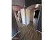 View of the kitchen, with stainless steel appliances, and arched doorways at 12422 N 121St Dr, El Mirage, AZ 85335