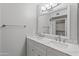 Bathroom with double sink vanity, framed mirror, and contemporary finishes at 12714 W Copperstone Dr, Sun City West, AZ 85375
