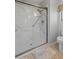 Bathroom showcasing a glass shower with marble surround and updated fixtures at 12714 W Copperstone Dr, Sun City West, AZ 85375