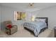 Neutral bedroom features carpet, a window, and a ceiling fan at 12714 W Copperstone Dr, Sun City West, AZ 85375