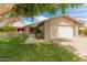 Inviting home showcasing a well-maintained lawn, covered patio, and a two-car garage at 12714 W Copperstone Dr, Sun City West, AZ 85375
